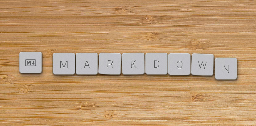 Laptop and cup of coffee with flower on desk